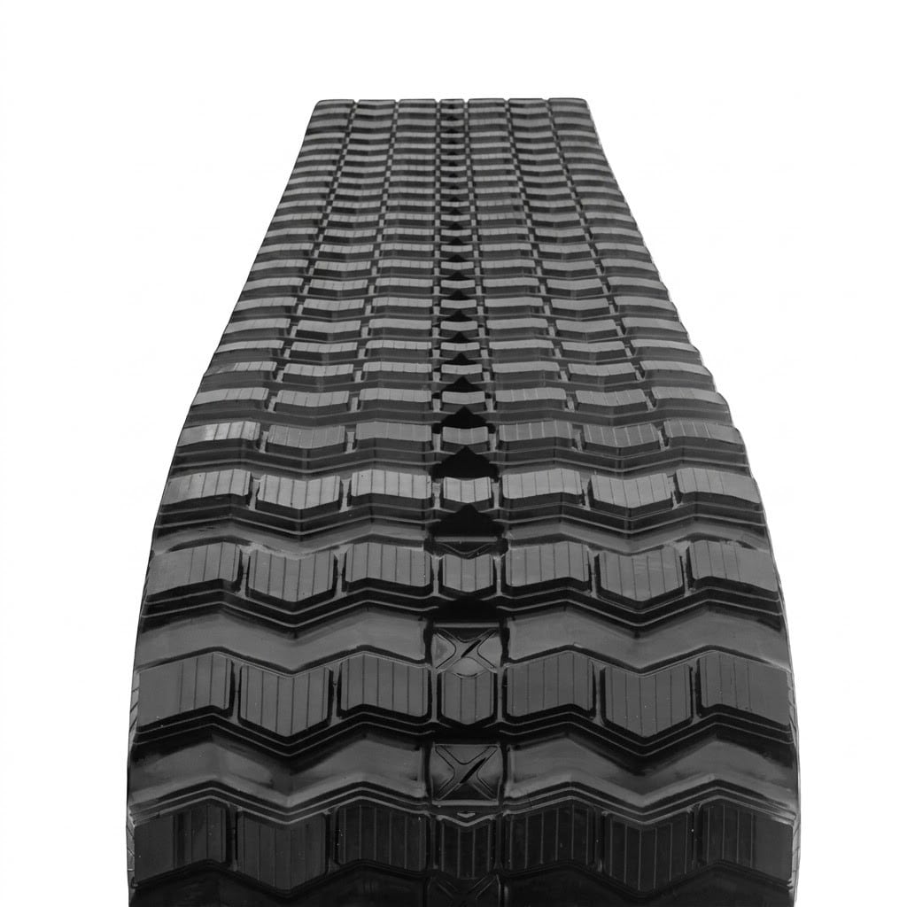 Aggressive mud-clearing Zig-Zag tread on a Caterpillar 249D rubber track.