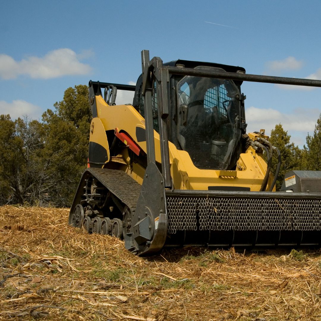 Skid steer in field